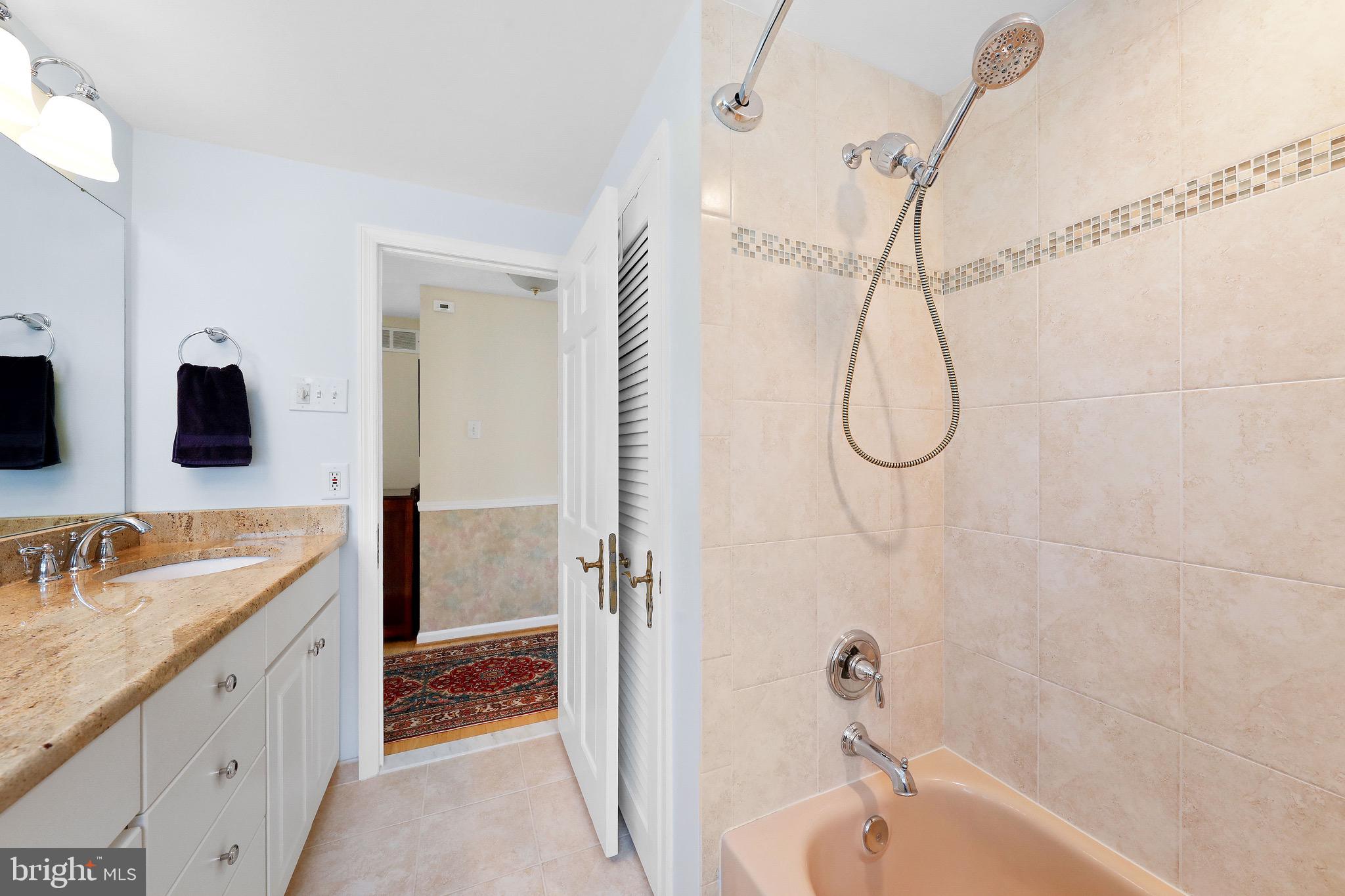 716 Liberty Road Mount Laurel, NJ 08054 - Photo 29 of 51 a bathroom with a granite countertop sink a mirror and a shower