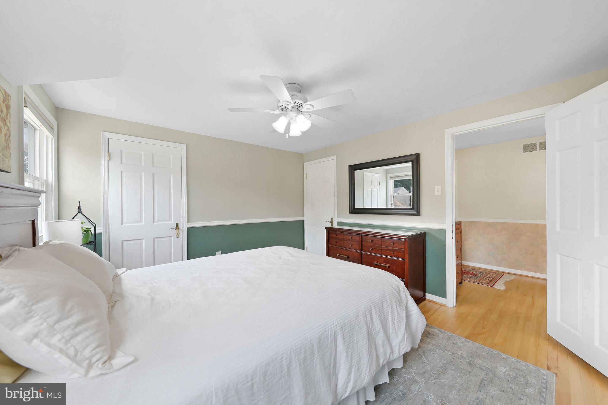 716 Liberty Road Mount Laurel, NJ 08054 - Photo 33 of 51 a bedroom with a large bed and a chandelier