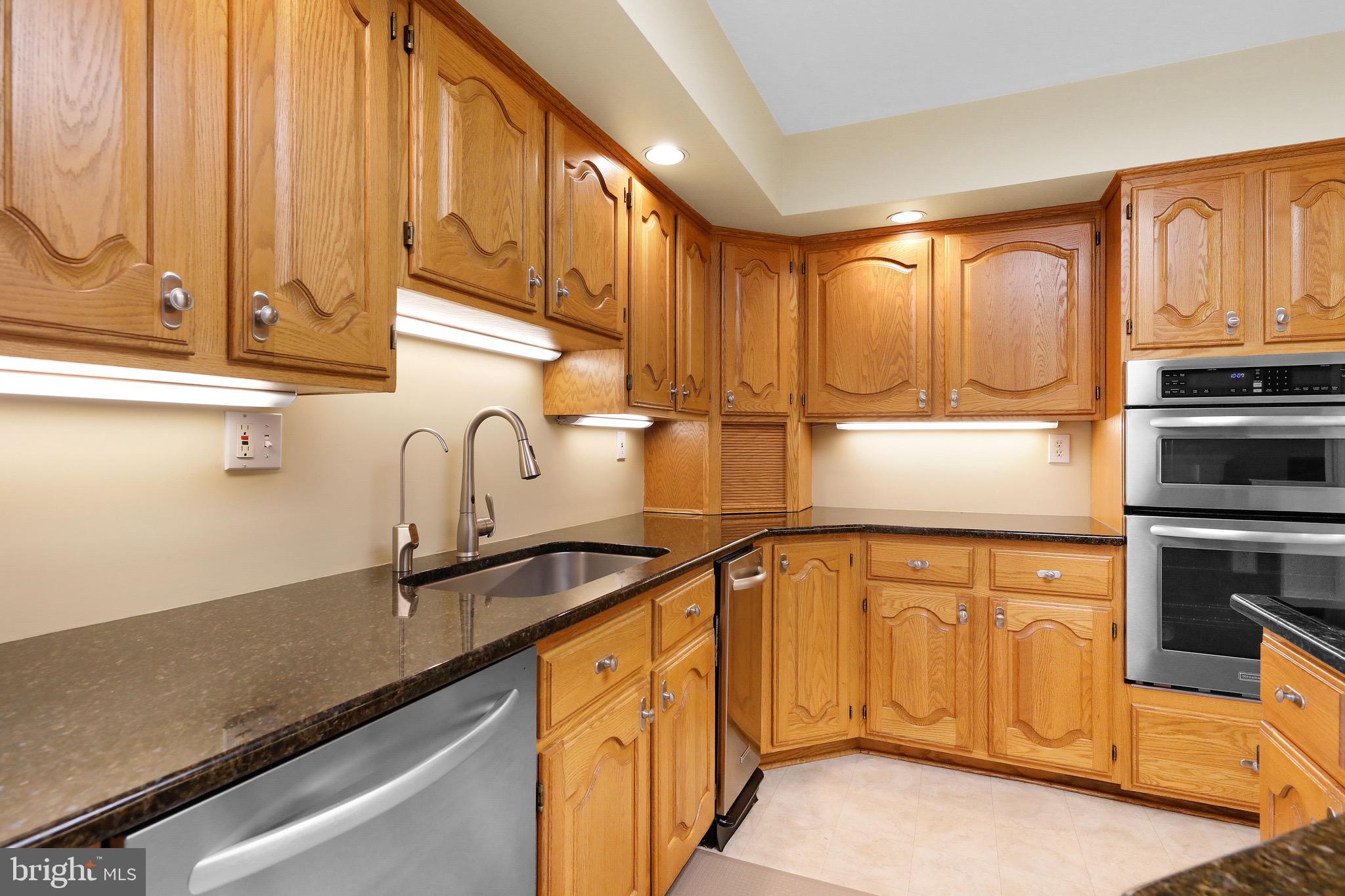 716 Liberty Road Mount Laurel, NJ 08054 - Photo 8 of 51 a kitchen with stainless steel appliances granite countertop a sink a stove and cabinets