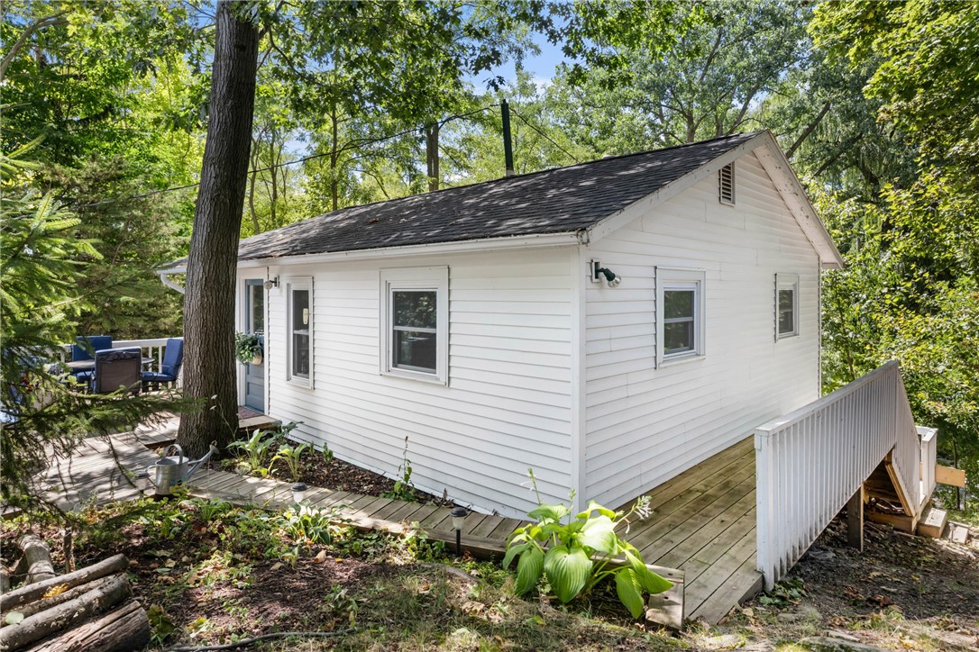 1695 Long Point Beach Road Torrey, NY 14527 - Photo 10 of 48 Rear deck and wraparound walkway