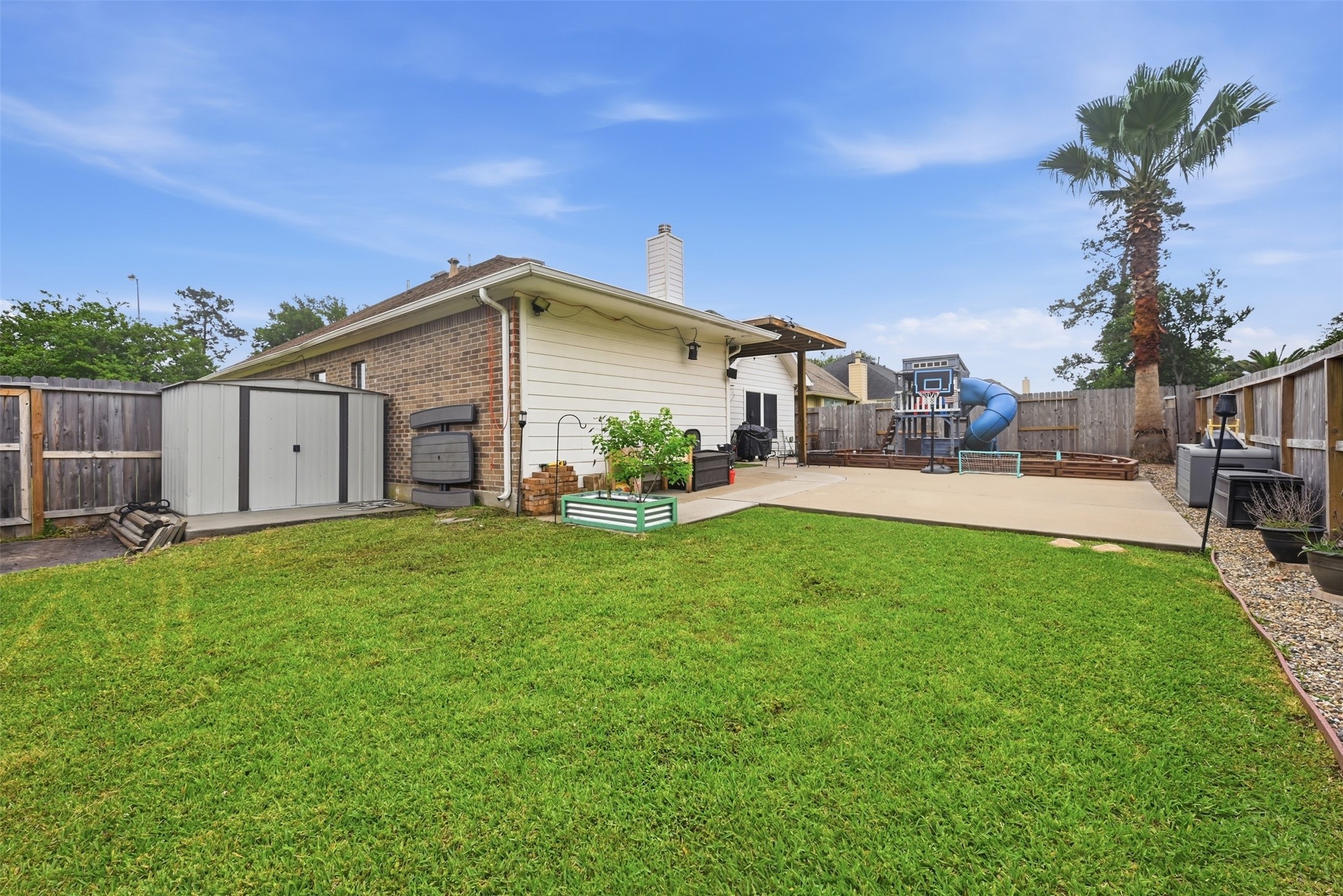 23819 Spring Dane Drive Spring, TX 77373 - Photo 33 of 42 This large backyard offers green space along with an extended patio for grilling on those summer nights.