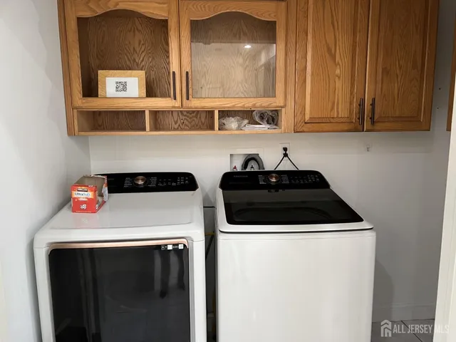 a utility room with dryer and washer