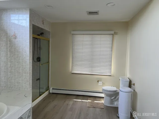 a bathroom with a toilet a sink and bathtub