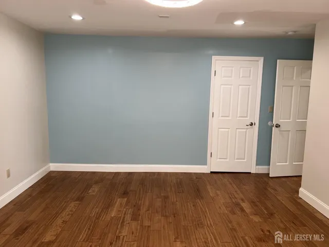 a view of wooden floor and brick walls