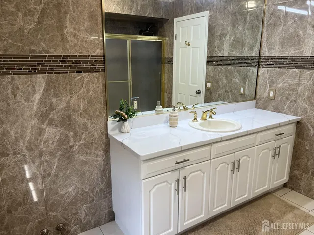 a bathroom with a sink and a mirror