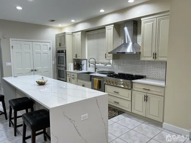 a kitchen with a sink cabinets and wooden floor