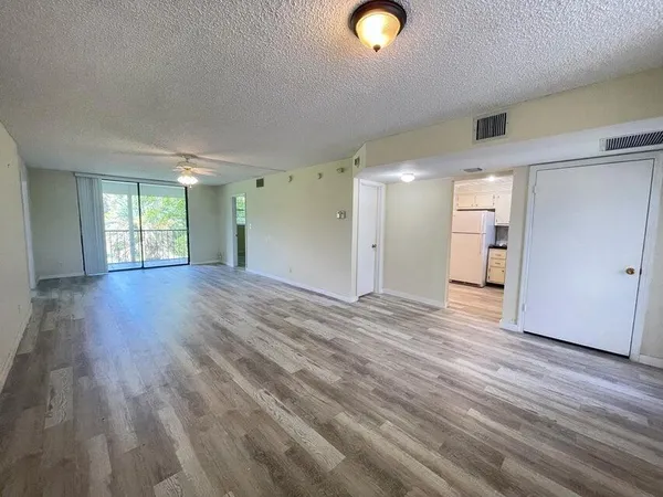 a view of a livingroom with wooden floor