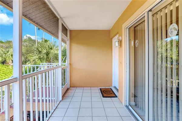 a view of a porch with wooden floor and stairs