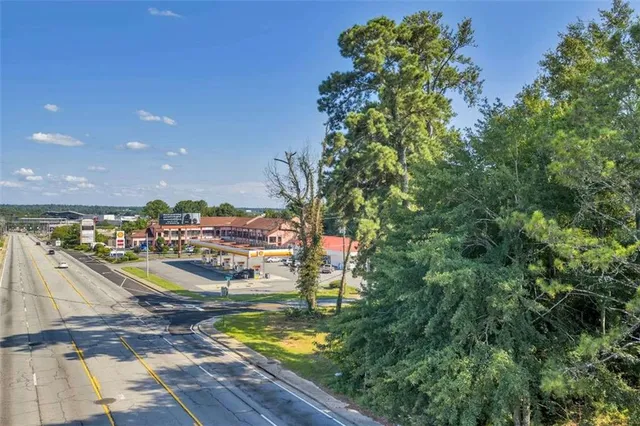 a view of a swimming pool with a patio