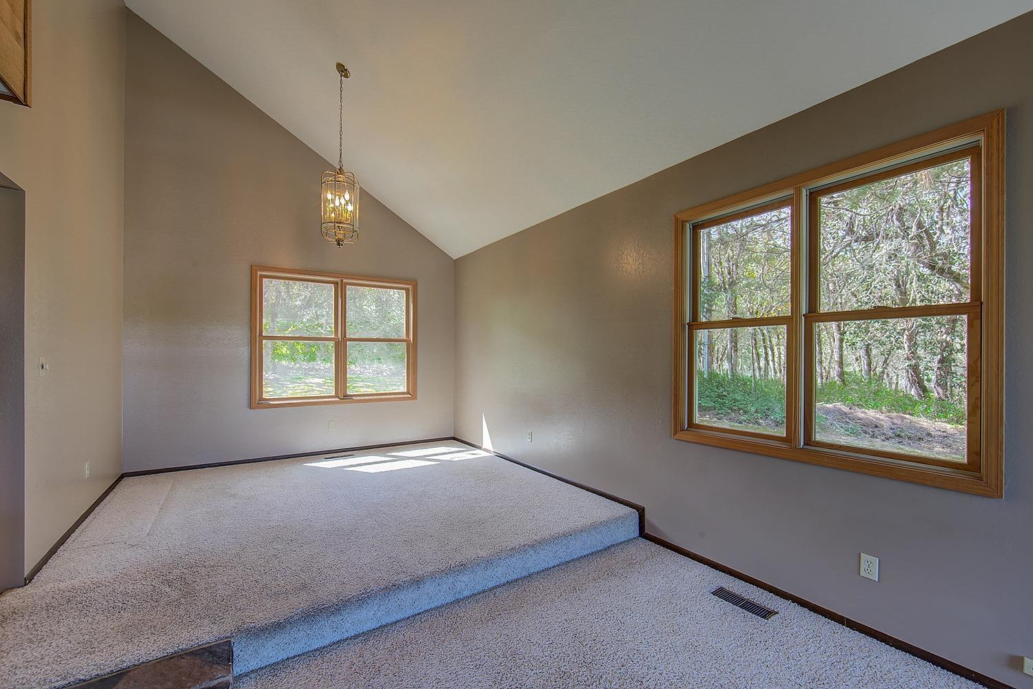 6475 Old Stage Road Central Point, OR 97502 - Photo 13 of 32 a view of an empty room with a window