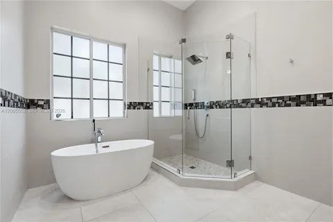 a view of a bathroom with a tub and sink