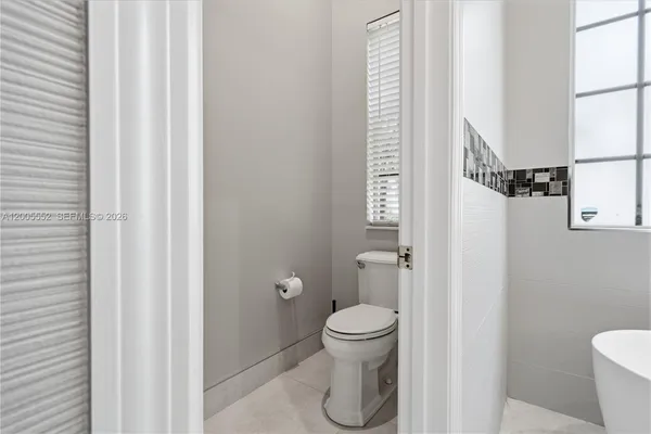 a room with a closet and wooden floor