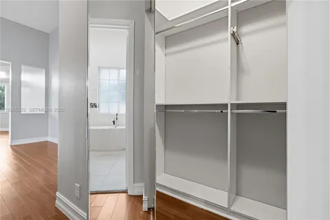 a view of washer and dryer with kitchen in the background