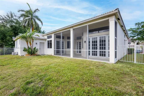 a view of a house with a backyard