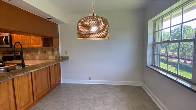 a kitchen with stainless steel appliances granite countertop a stove and a sink