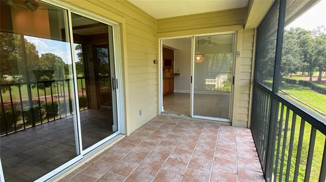 a view of a glass door with a balcony