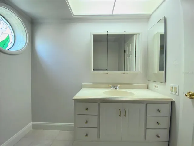 a bathroom with a sink and a mirror