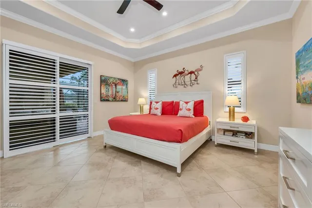 a spacious bedroom with a bed and a cabinets