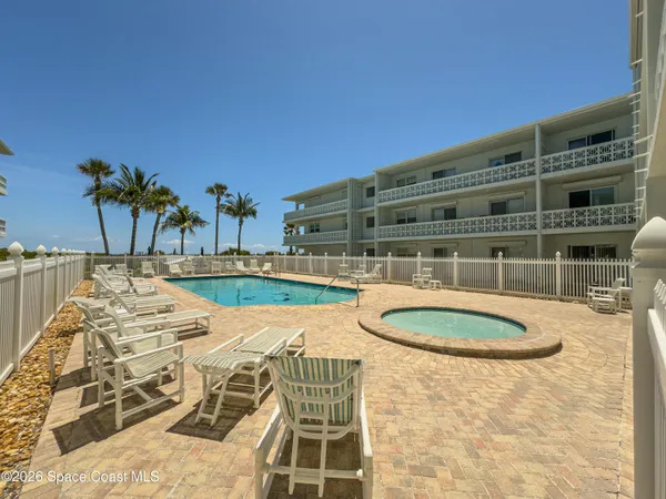 a view of a swimming pool with a patio