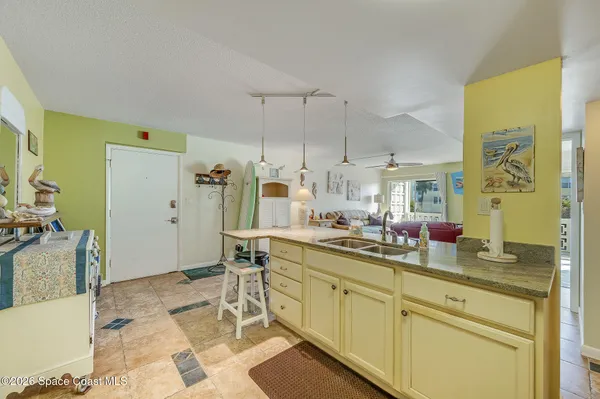 a kitchen with a sink cabinets and window