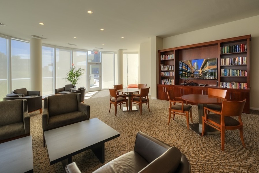 807 Davis Street, Unit 1710 Evanston, IL 60201 - Photo 15 of 21 a living room with furniture and a large window