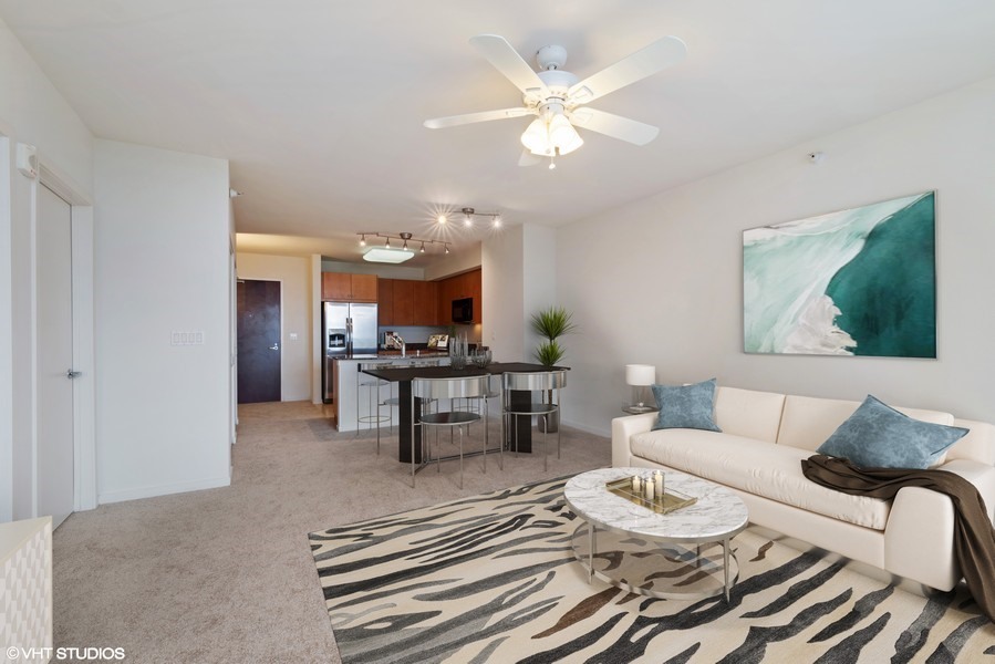 807 Davis Street, Unit 1710 Evanston, IL 60201 - Photo 4 of 21 a living room with furniture and view of kitchen