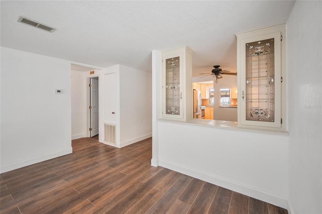 4434 Tucker Square New Port Richey, FL 34652 - Photo 11 of 37 wooden floor in an empty room