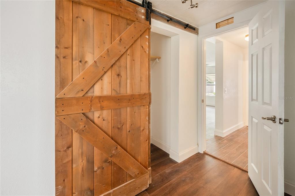4434 Tucker Square New Port Richey, FL 34652 - Photo 17 of 37 a view of entryway with wooden floor