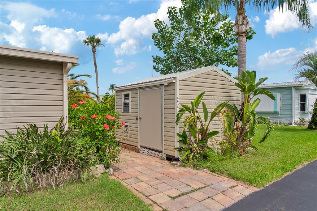 4434 Tucker Square New Port Richey, FL 34652 - Photo 27 of 37 a front view of a house with garden