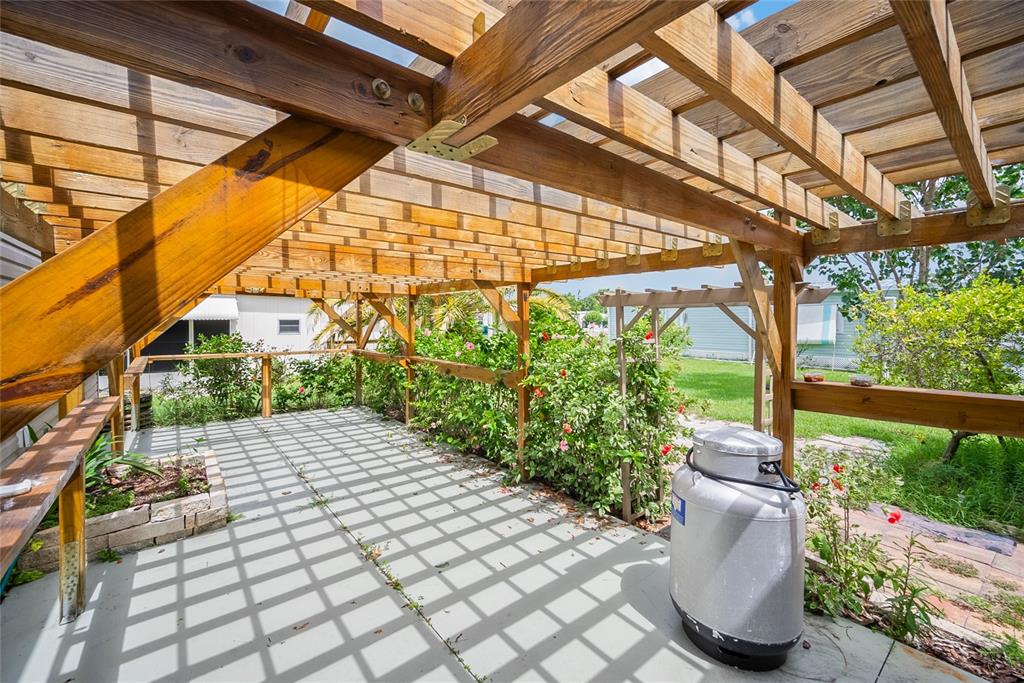 4434 Tucker Square New Port Richey, FL 34652 - Photo 28 of 37 a view of a porch with plants