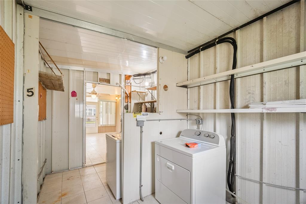 4434 Tucker Square New Port Richey, FL 34652 - Photo 29 of 37 a storage room with washer and dryer