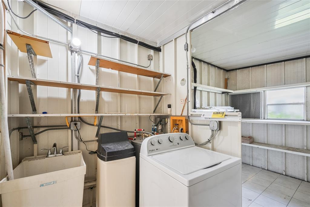 4434 Tucker Square New Port Richey, FL 34652 - Photo 30 of 37 a utility room with dryer and washer