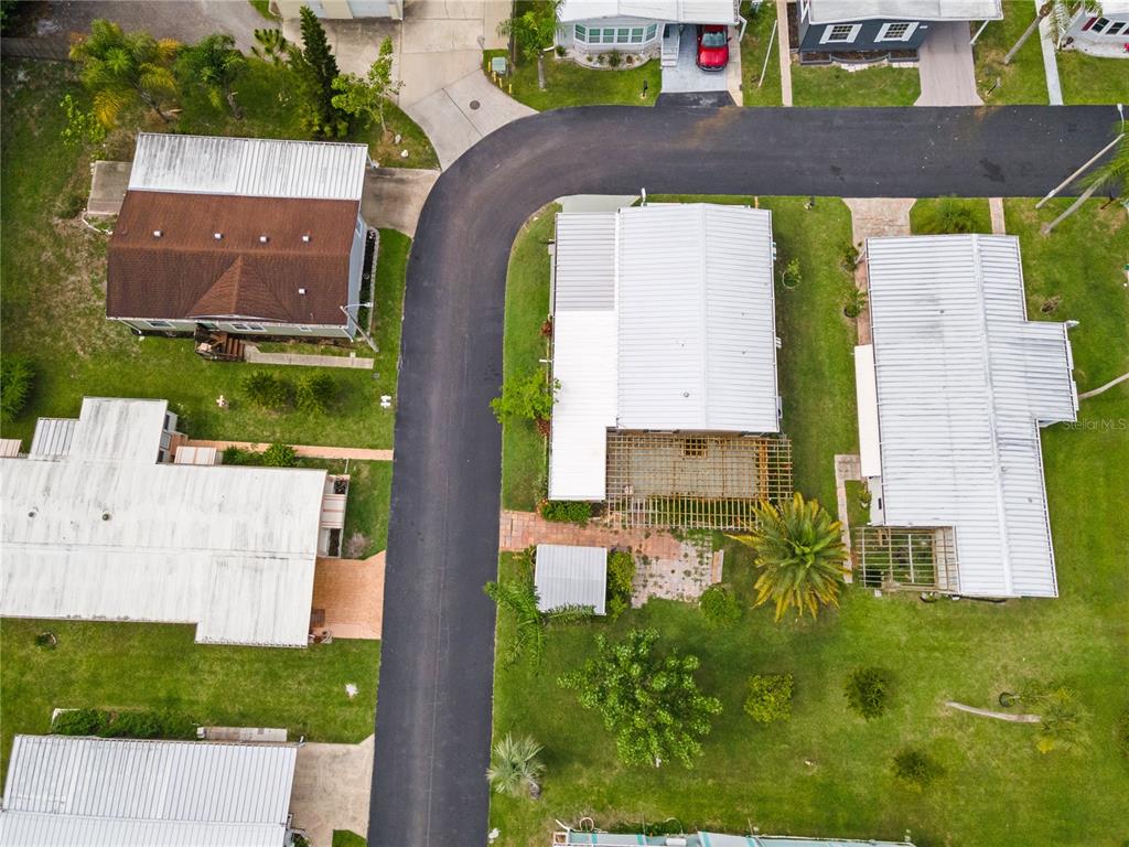 4434 Tucker Square New Port Richey, FL 34652 - Photo 32 of 37 an aerial view of a house with garden space and a street view
