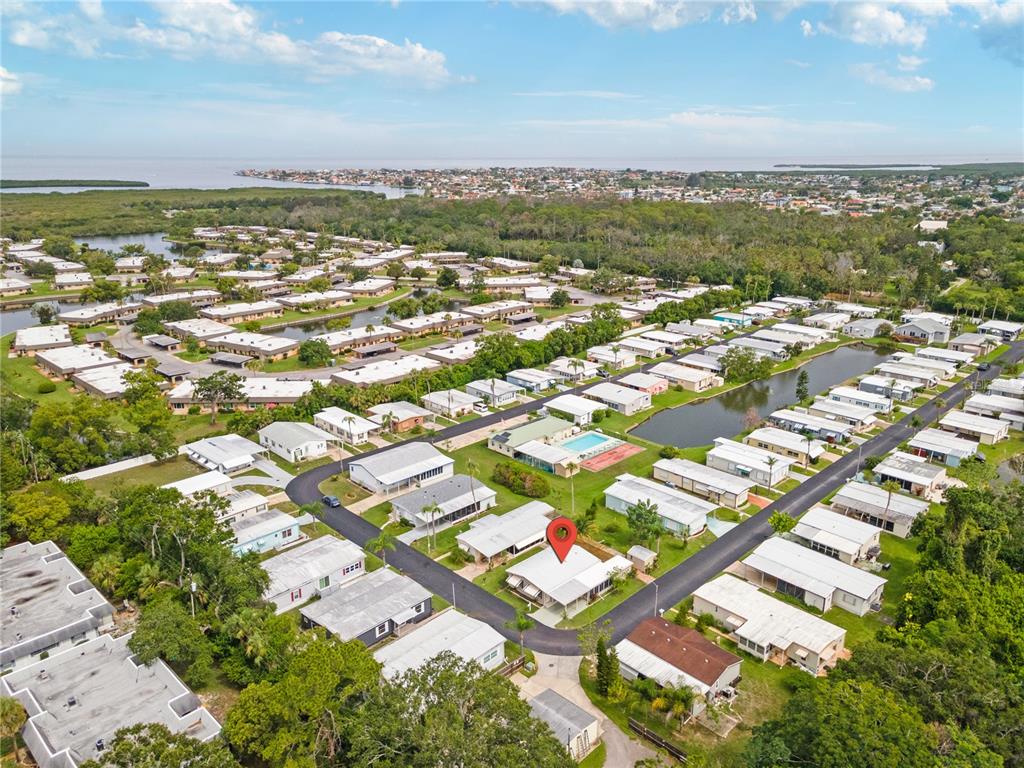 4434 Tucker Square New Port Richey, FL 34652 - Photo 36 of 37 an aerial view of residential building with parking space