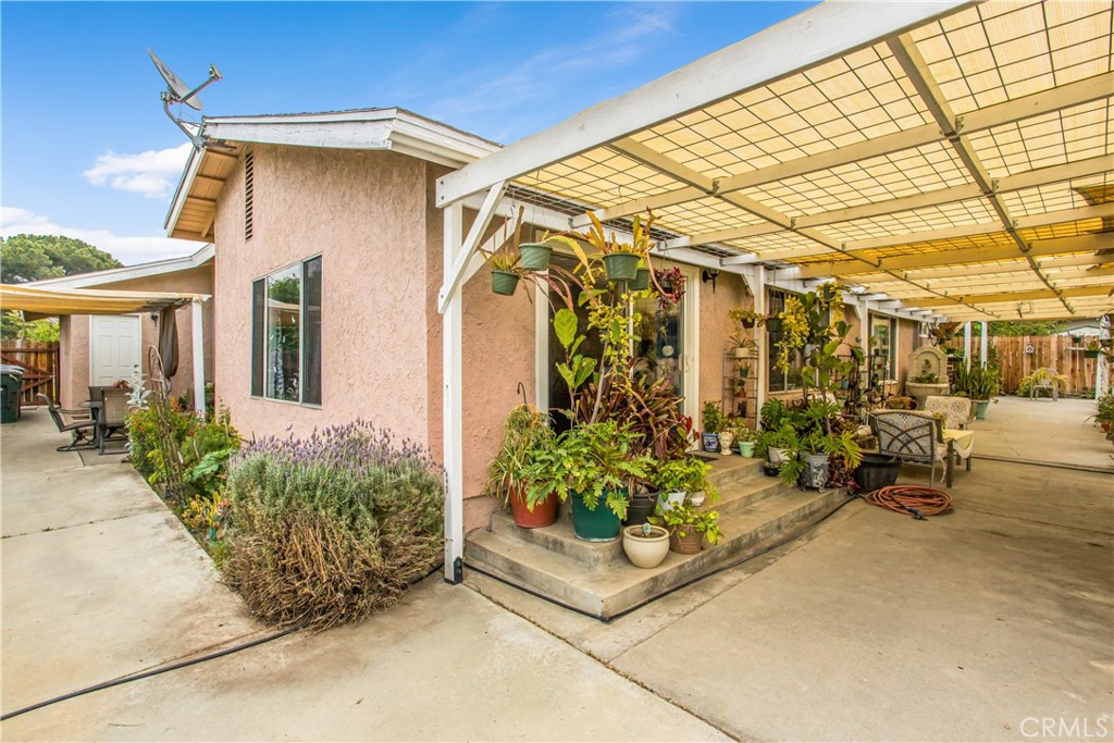 3396 Spring Garden Street Riverside, CA 92501 - Photo 22 of 28 a front view of a house with garden