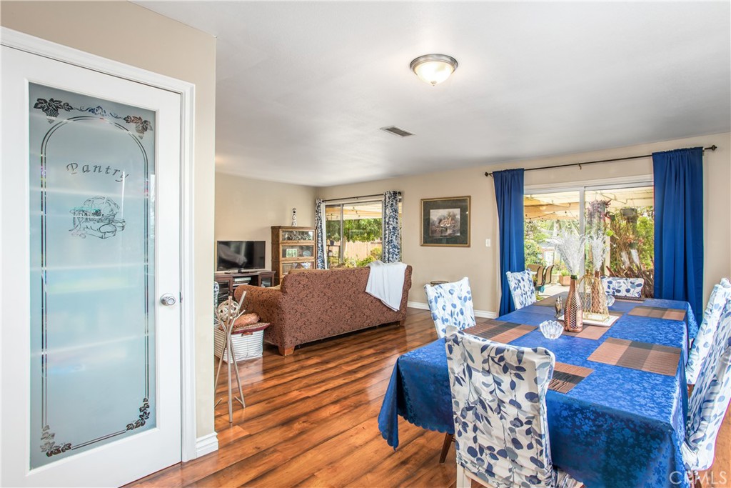 3396 Spring Garden Street Riverside, CA 92501 - Photo 8 of 28 a living room with furniture large window and wooden floor