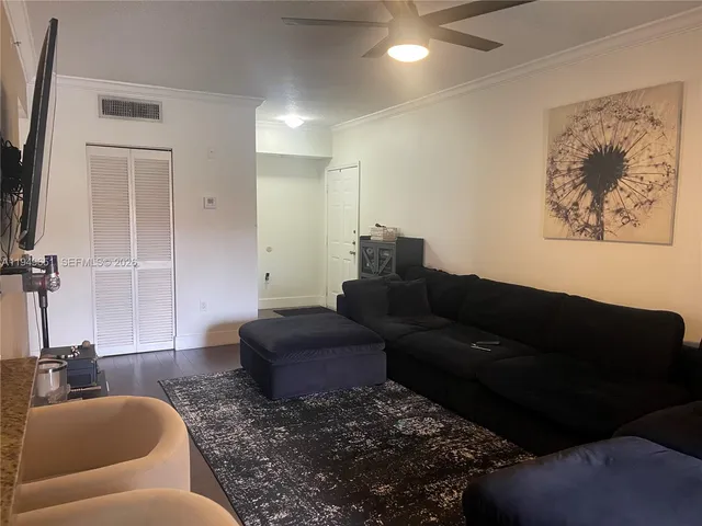a living room with furniture and a rug
