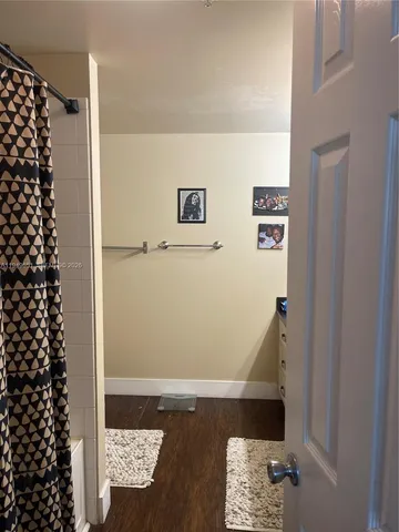 a bathroom with a sink vanity and a mirror