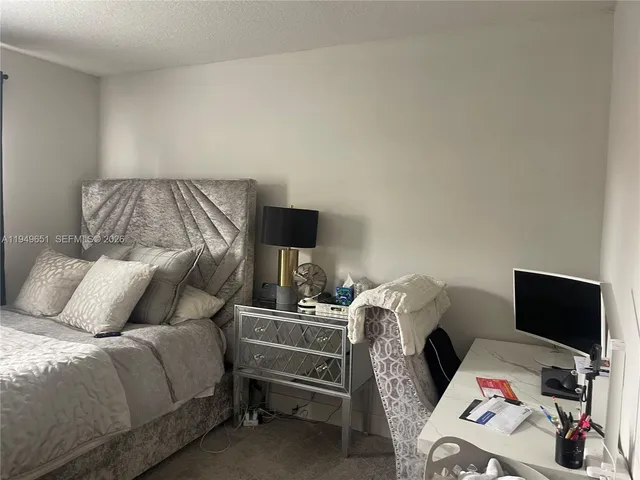 a bedroom with a bed and television