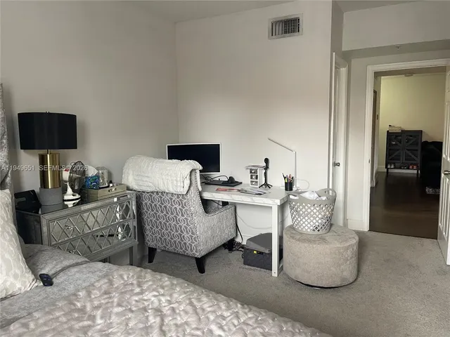 a view of a bathroom from a hallway