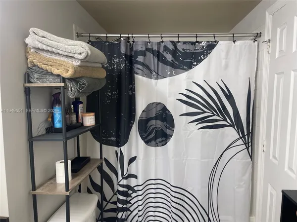 a view of a balcony with wooden floor