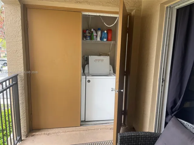 a utility room with dryer and washer