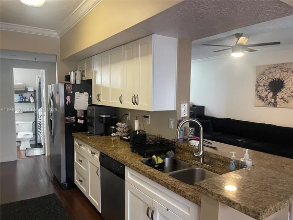 a kitchen with a sink and cabinets