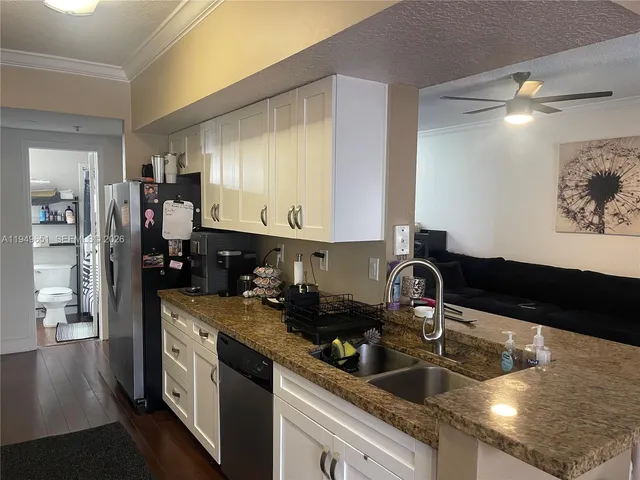 a kitchen with a sink and cabinets