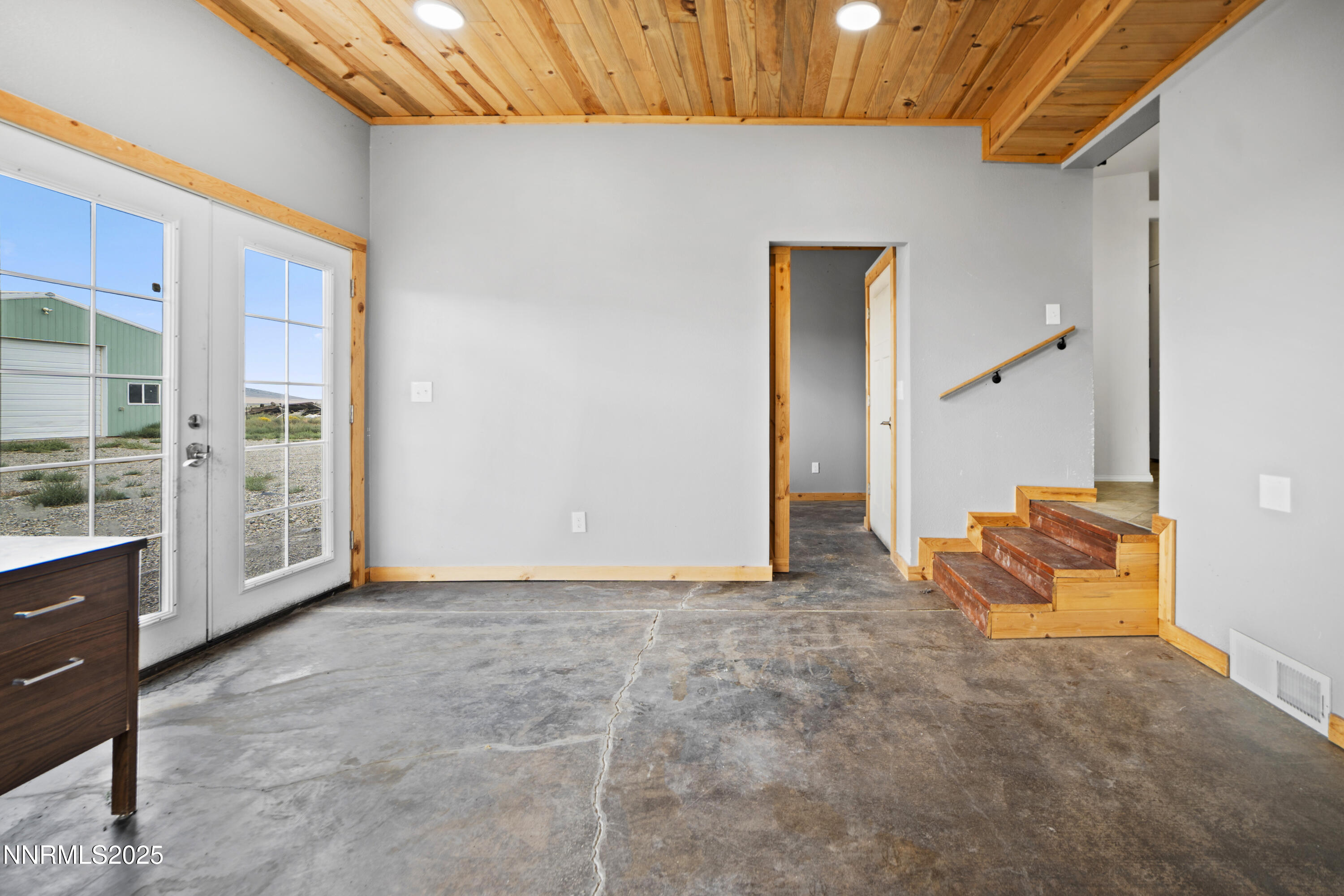 3900 Van Diest Road Winnemucca, NV 89445 - Photo 18 of 45 a view of an empty room with furniture and a window