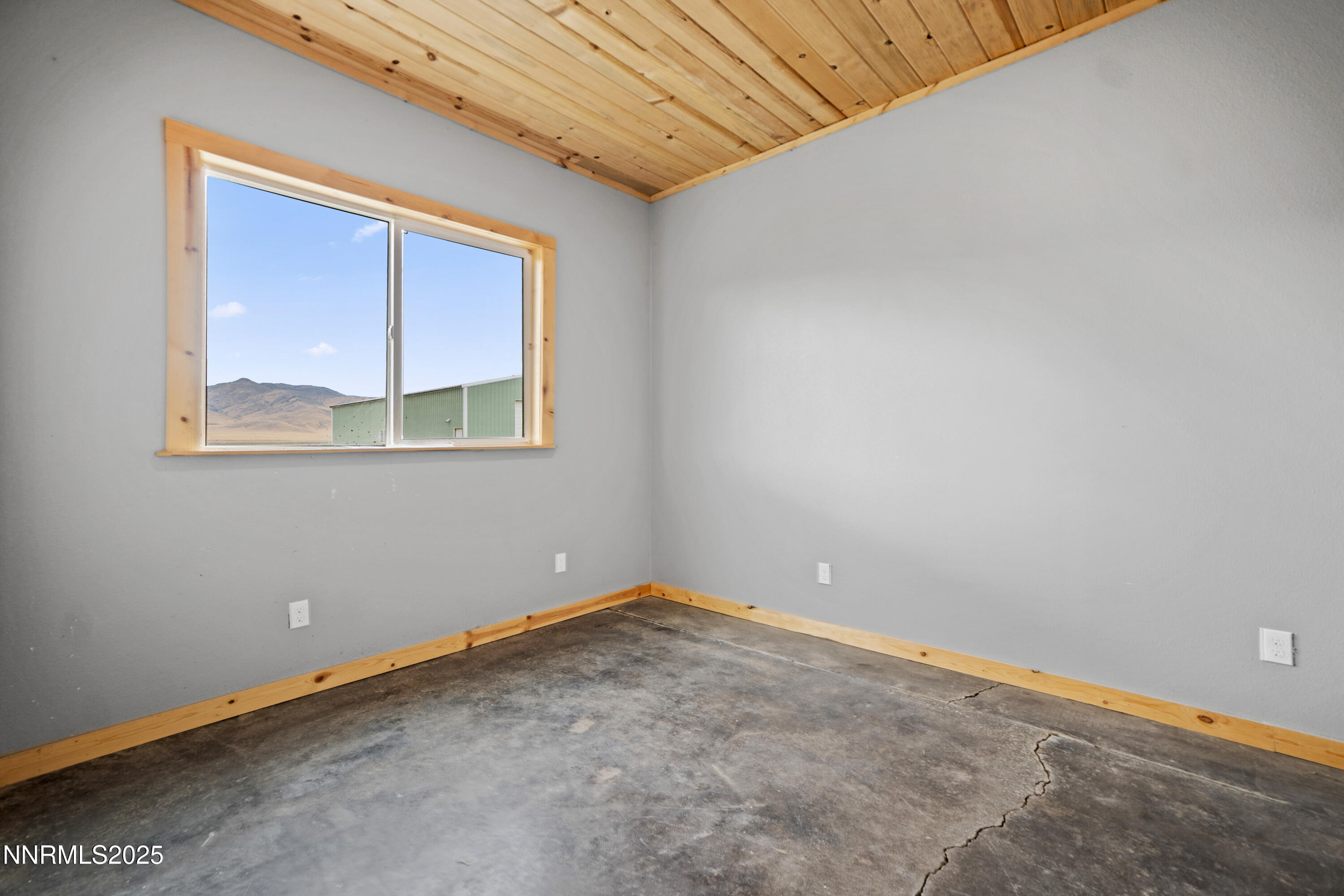 3900 Van Diest Road Winnemucca, NV 89445 - Photo 19 of 45 a view of an empty room with a window