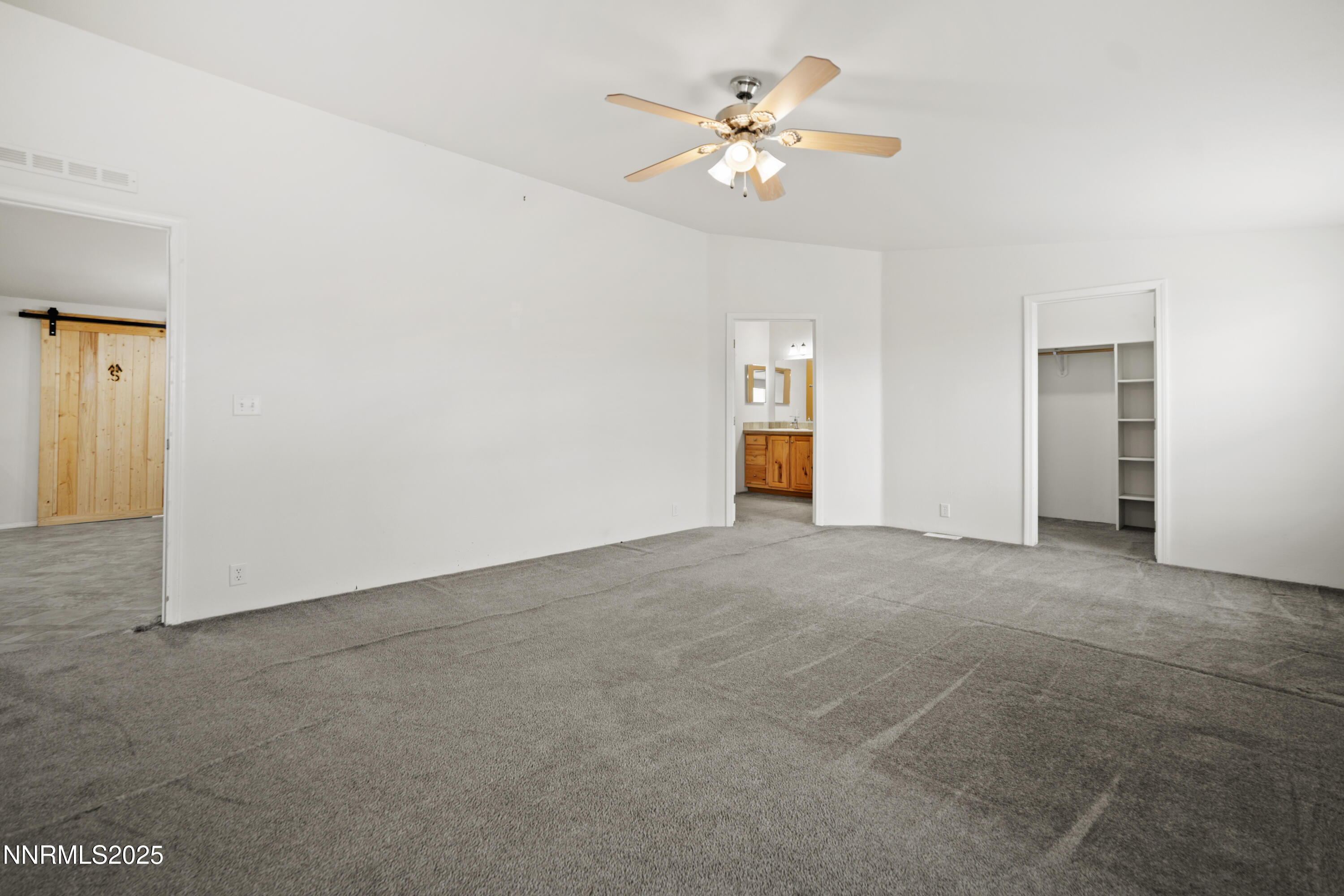 3900 Van Diest Road Winnemucca, NV 89445 - Photo 21 of 45 a view of an empty room with a chandelier fan
