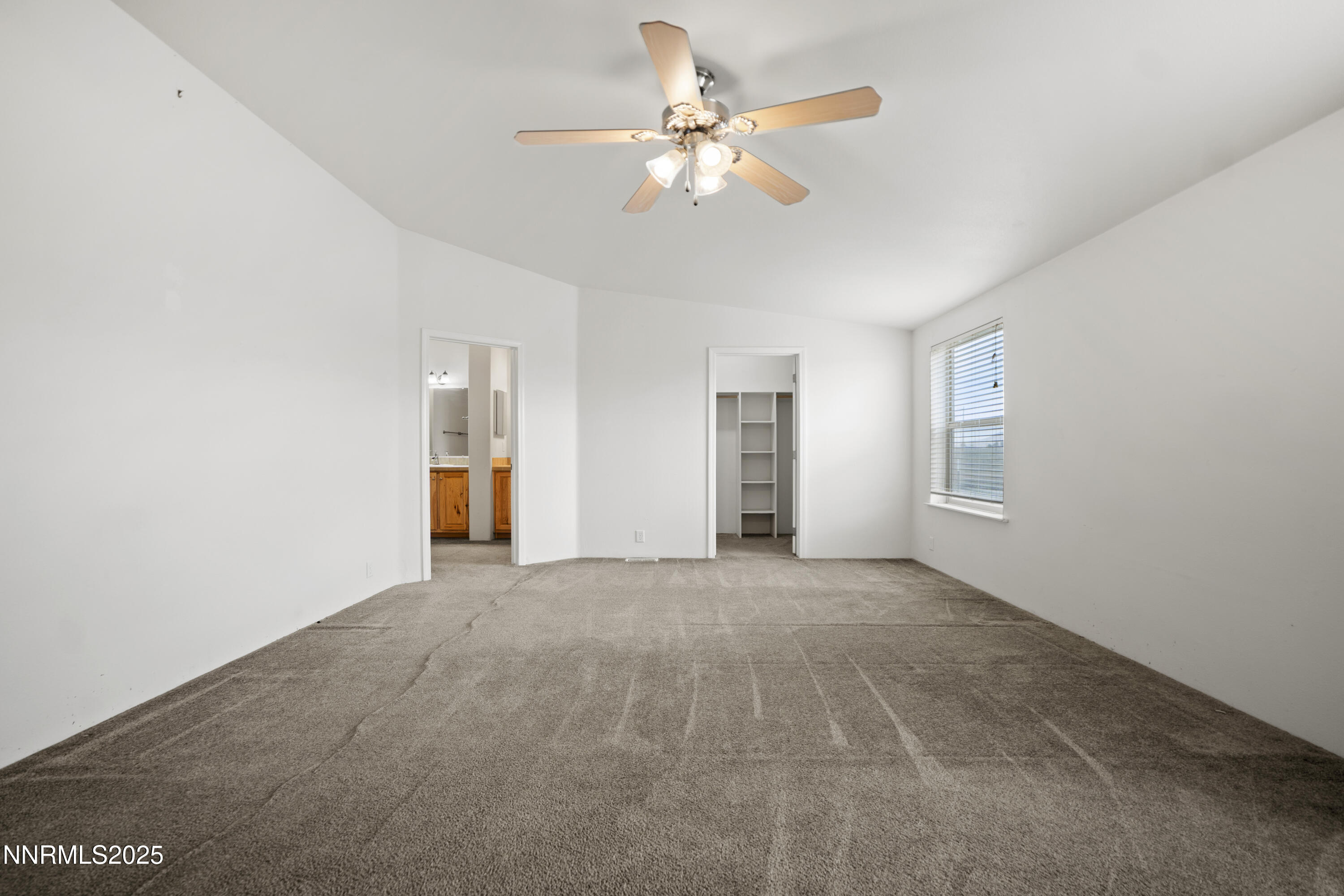 3900 Van Diest Road Winnemucca, NV 89445 - Photo 23 of 45 a view of an empty room with a ceiling fan
