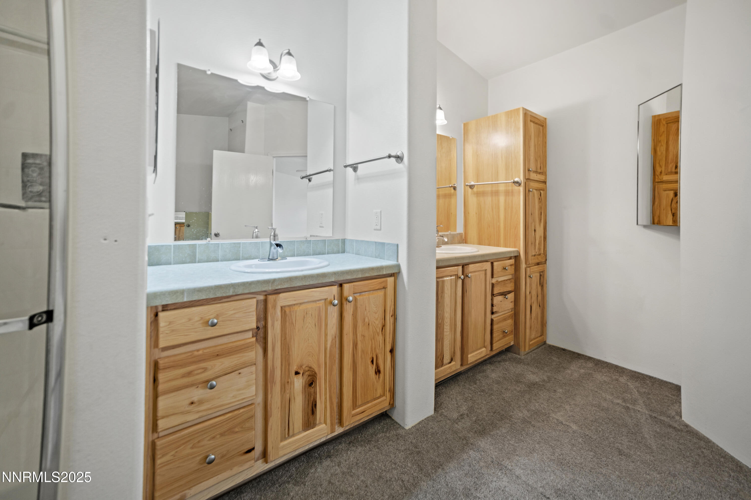 3900 Van Diest Road Winnemucca, NV 89445 - Photo 26 of 45 a bathroom with a granite countertop sink and a mirror