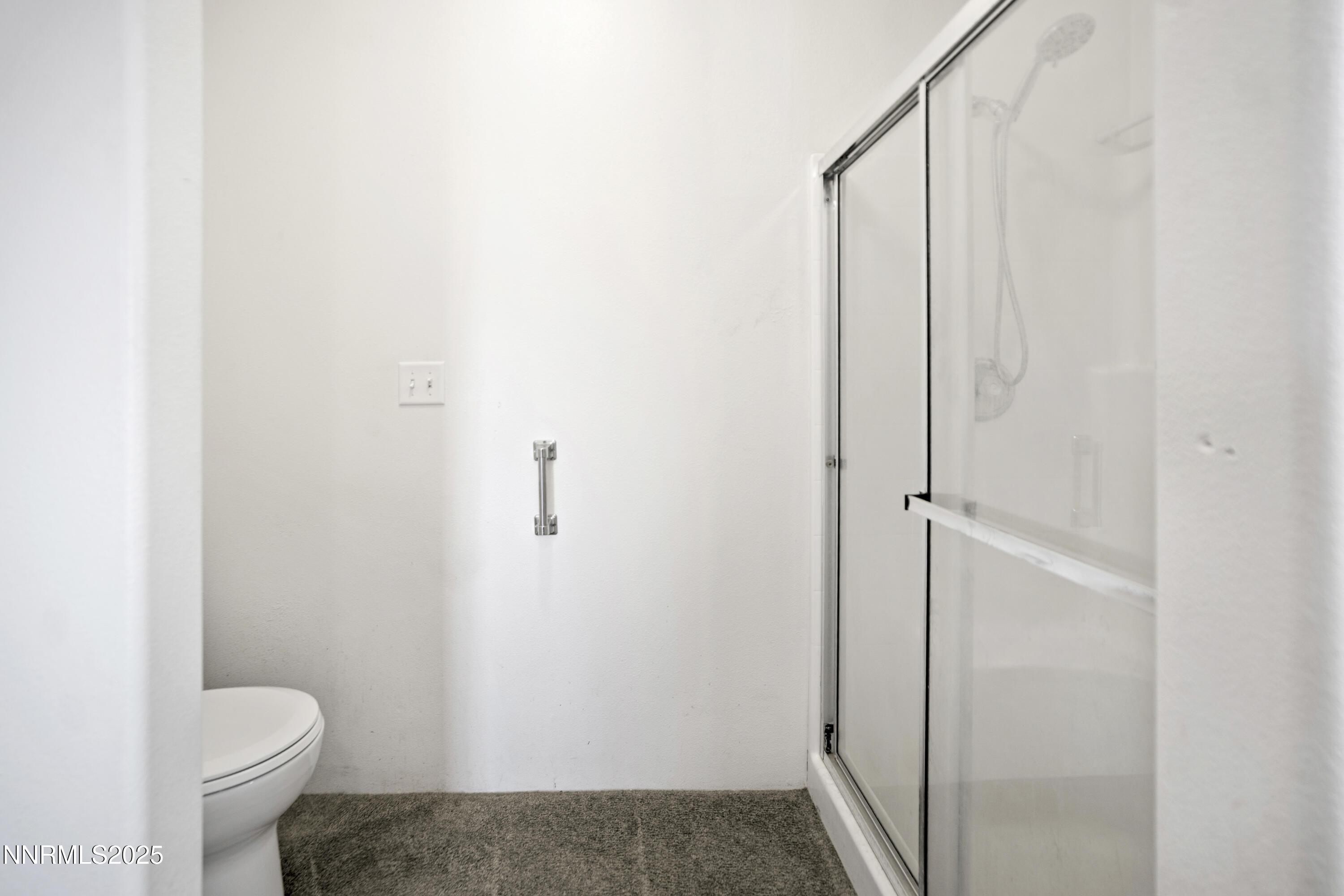 3900 Van Diest Road Winnemucca, NV 89445 - Photo 29 of 45 a bathroom with a granite countertop toilet and a shower